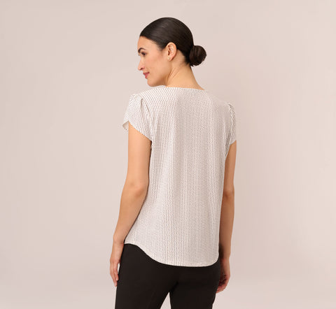 Short Sleeve Printed Top With Pleated Details In Ivory Black Seed Dot