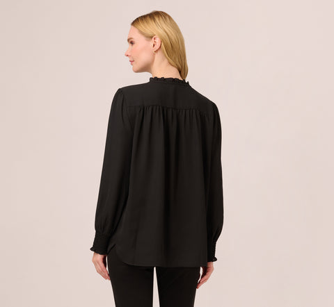 Ruffle Tie Neck Top With Smocked Long Sleeves In Black