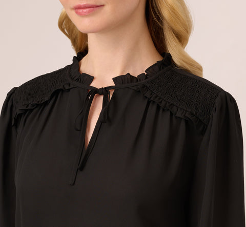 Ruffle Tie Neck Top With Smocked Long Sleeves In Black