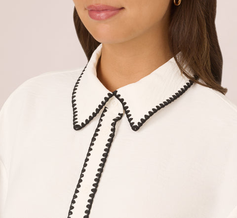 Long Sleeve Button Down Top With Embroidered Details In Ivory Black