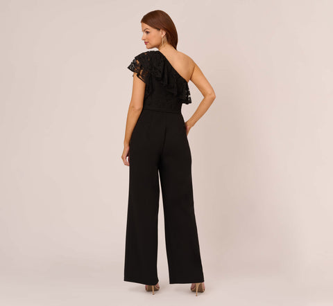 One Shoulder Crepe Jumpsuit With Lace Ruffle Details In Black