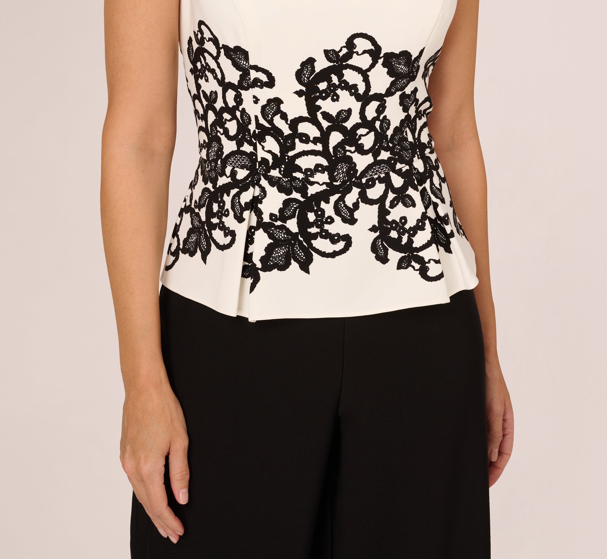 Sleeveless Peplum Jumpsuit With Scroll Lace Details In Ivory Black