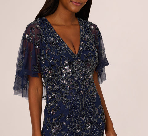 Sequin Beaded Gown With Sheer Cape Sleeves In Light Navy