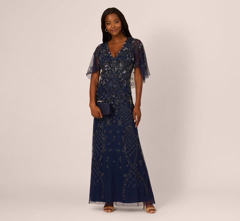 Sequin Beaded Gown With Sheer Cape Sleeves In Light Navy