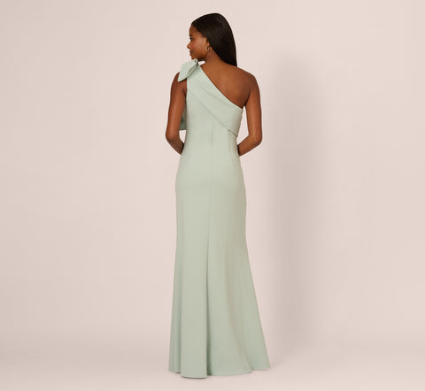 Stretch Crepe One Shoulder Mermaid Gown With Bow Accent In Icy Sage