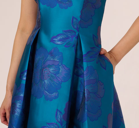 Floral Jacquard One Shoulder High Low Gown With Rosette Accent In Teal Blue