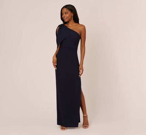 One Shoulder Crepe Gown With Bow Accent In Midnight