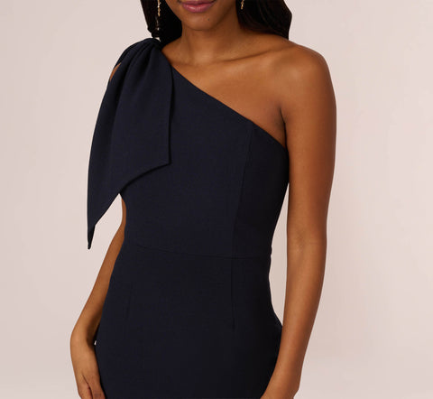 One Shoulder Crepe Gown With Bow Accent In Midnight