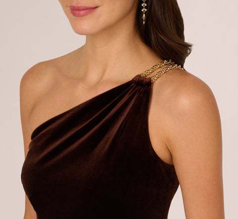 One Shoulder Draped Velvet Gown With Chain Accent In Dark Brown